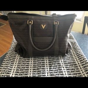 Mario Valentino with Dustbag.